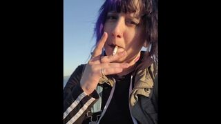 Alternative Girl Smoking Cigarettes on the Beach