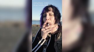 Alternative Girl Smoking Cigarettes on the Beach