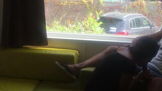 Wife giving risky blowjob in front of window in a camper van