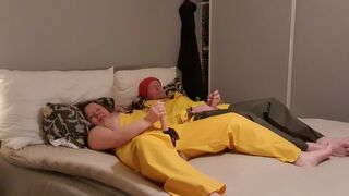 Romantic play with two dicks in rainwear