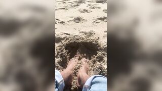 BIG FEET playing in the sand