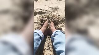 BIG FEET playing in the sand