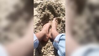 BIG FEET playing in the sand