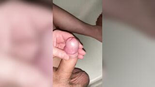 nude male does quick soft to hard handjob with uncut cock lots of cum