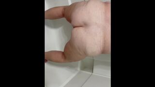 Mature peeing in toilet and shower