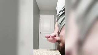 Stroking thick cock with cum shot