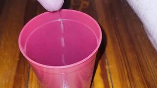 Teen fills cup with piss