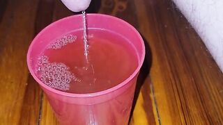 Teen fills cup with piss