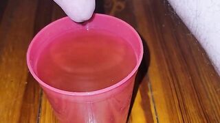 Teen fills cup with piss