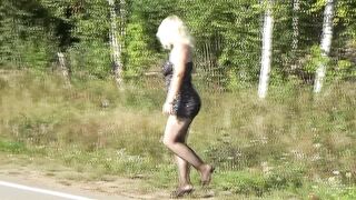 Milf in a mini dress on the road