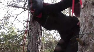 Tied up to a tree outdoor on sexy clothes, wearing pantyhose and high ankle boots heels, rough fuck