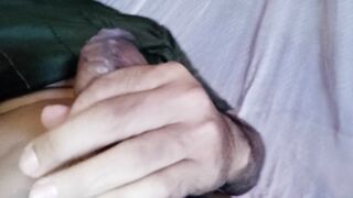 Man jerking off in bed until cumming