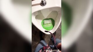 Pissing into a urinal in a pub. I play football with urine