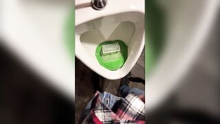 Pissing into a urinal in a pub. I play football with urine