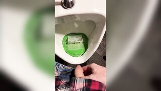 Pissing into a urinal in a pub. I play football with urine