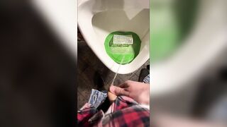 Pissing into a urinal in a pub. I play football with urine