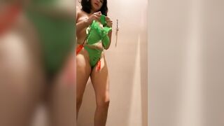 Teen trying on lingerie in mall dressing room