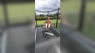 Girl in bikini jumping on trampoline. Man show style!