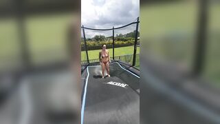 Girl in bikini jumping on trampoline. Man show style!