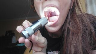 Giantess plays with a tiny in her mouth before swallowing it