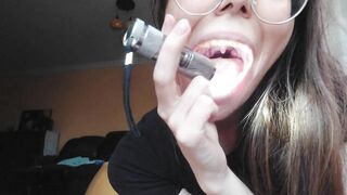 Giantess plays with a tiny in her mouth before swallowing it