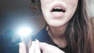 Giantess plays with a tiny in her mouth before swallowing it