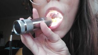 Giantess plays with a tiny in her mouth before swallowing it