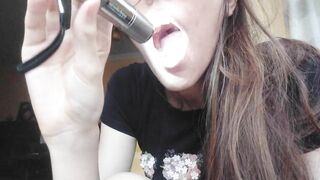 Giantess plays with a tiny in her mouth before swallowing it