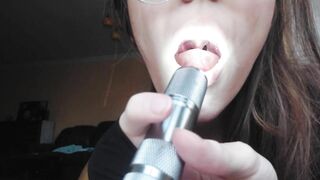 Giantess plays with a tiny in her mouth before swallowing it