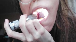 Giantess plays with a tiny in her mouth before swallowing it