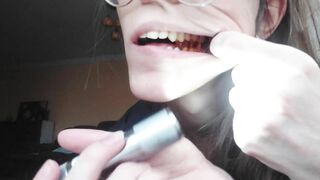 Giantess plays with a tiny in her mouth before swallowing it