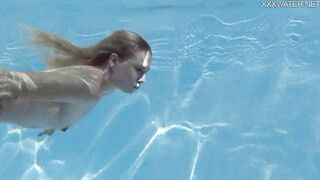 Finnish blonde tattooed pornstar Mimi underwater