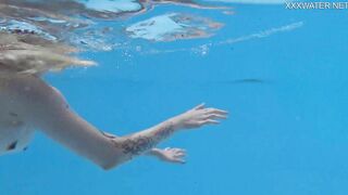 Finnish blonde tattooed pornstar Mimi underwater