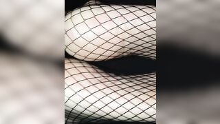 The wife giving me a footjob in fishnet stockings