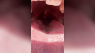 A nice girl shows mouth throat uvual and sloppy wet tongue