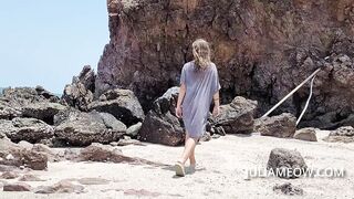 Hot mom in transparent t-shirt on the beach at low tide