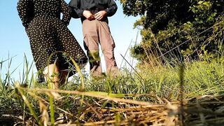 Mother-in-law in a new dress bends over and pisses in nature with her son-in-law