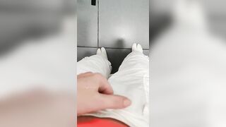 Girl pissing in airport toilet.